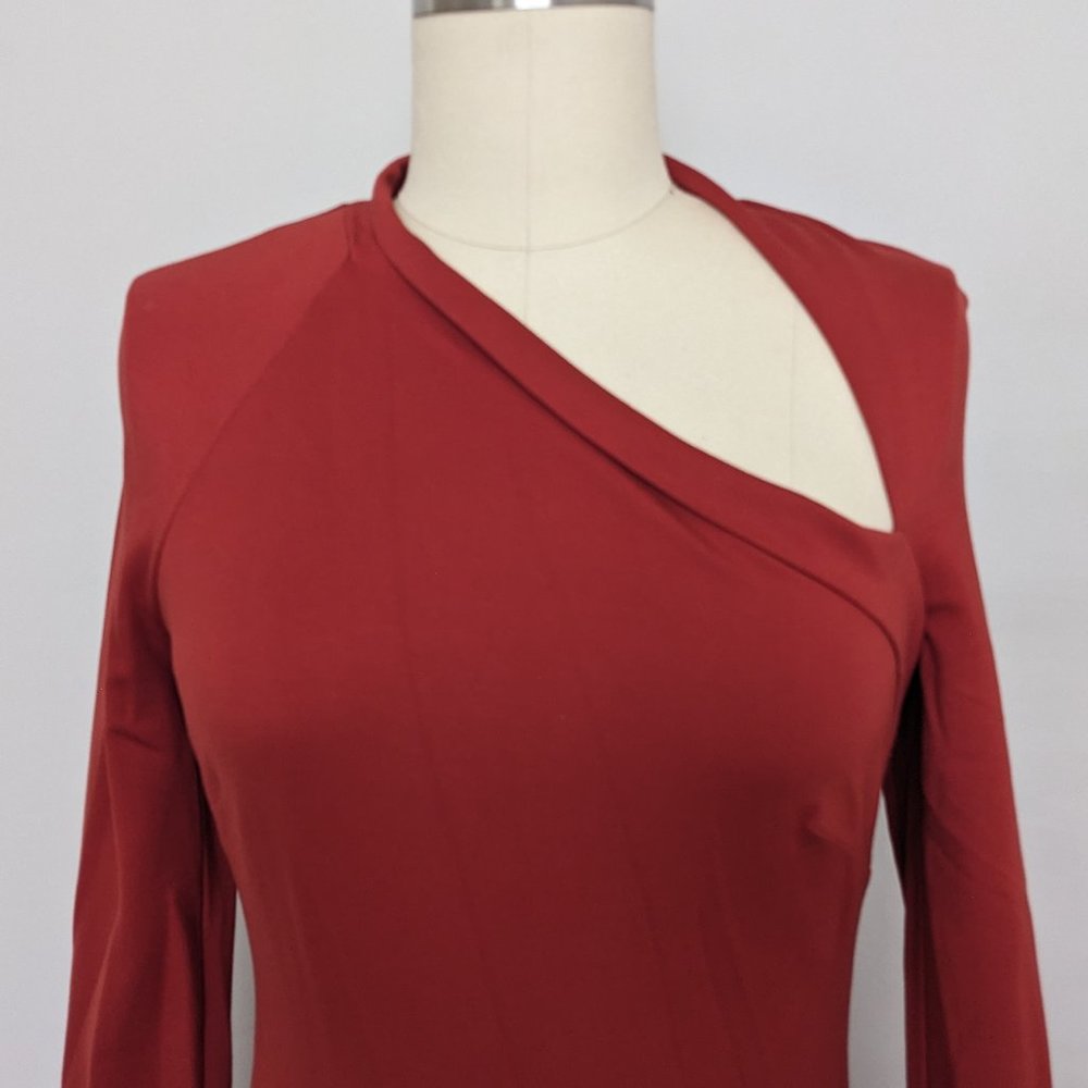 bebe burnt orange rust long sleeve bodycon dress asymmetrical top and bottom